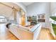 Open living room features high ceilings, hardwood floors, a fireplace, built-in shelving and large windows at 58 Rogers Ct, Golden, CO 80401