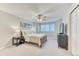 Serene main bedroom offers natural light, ceiling fan and ensuite bath at 58 Rogers Ct, Golden, CO 80401