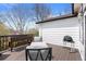 Back deck with light chairs surrounding a table and an attached planter box at 5133 S Liverpool Way, Centennial, CO 80015