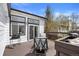 Relaxing back deck seating area with a grill and easy access to the home's interior at 5133 S Liverpool Way, Centennial, CO 80015