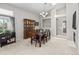 Traditional dining room featuring a wooden table set, china cabinet, and neutral walls and carpet at 5133 S Liverpool Way, Centennial, CO 80015
