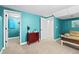 Light blue living room offering access to storage, access to another room, and cozy seating at 5133 S Liverpool Way, Centennial, CO 80015