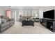 Inviting living room featuring plush sofas, a stylish coffee table, and a modern entertainment center at 5133 S Liverpool Way, Centennial, CO 80015