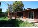 Backyard featuring a wooden deck and patio, perfect for outdoor relaxation at 6775 S Sherman St, Centennial, CO 80122