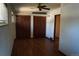 Bedroom featuring two spacious closets, hardwood floors and natural light at 6775 S Sherman St, Centennial, CO 80122
