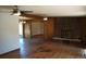 Spacious living room with a brick fireplace and hardwood floors at 6775 S Sherman St, Centennial, CO 80122