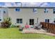 Relaxing backyard with a cozy patio, lush green lawn, and privacy fence, perfect for outdoor entertaining at 5546 S Quemoy Cir, Aurora, CO 80015