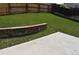 Expansive backyard boasts a lush green lawn, a patio area, and a charming stone retaining wall at 5546 S Quemoy Cir, Aurora, CO 80015