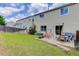 Spacious backyard with a charming patio, green grass, and secure fencing, ideal for Gathering gatherings and play at 5546 S Quemoy Cir, Aurora, CO 80015