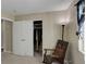 Cozy bedroom with closet, rocking chair, and accent lighting creating a relaxing and inviting atmosphere at 5546 S Quemoy Cir, Aurora, CO 80015