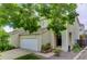 Well-maintained townhome with a two-car garage, neat landscaping, and a welcoming entrance in a Gathering-friendly area at 5546 S Quemoy Cir, Aurora, CO 80015