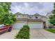 Inviting townhome with a two-car garage and well-maintained landscaping, perfect for comfortable living at 5546 S Quemoy Cir, Aurora, CO 80015