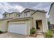 Beautiful townhome featuring a two-car garage, lovely landscaping, and inviting curb appeal in a great neighborhood at 5546 S Quemoy Cir, Aurora, CO 80015