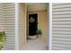 Welcoming front entrance with a decorative wreath, stylish door, and charming potted plants, creating a warm ambiance at 5546 S Quemoy Cir, Aurora, CO 80015