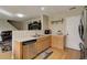 Modern kitchen features stainless steel dishwasher, light wood cabinets, and plenty of natural light at 5546 S Quemoy Cir, Aurora, CO 80015