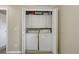 In-unit laundry closet featuring a washer and dryer, offering convenience and maximizing space at 5546 S Quemoy Cir, Aurora, CO 80015