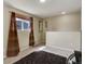 Bright living room featuring neutral walls, natural light, contemporary decor, and carpeted floor at 5546 S Quemoy Cir, Aurora, CO 80015