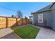 Backyard featuring low maintenance turf, gravel, and privacy fence at 3300 W 2Nd Ave, Denver, CO 80219