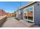 Backyard patio featuring concrete pavers leading to sliding glass doors at 3300 W 2Nd Ave, Denver, CO 80219