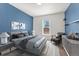 Stylish bedroom featuring a comfortable queen-sized bed, contemporary decor, and ample natural light from the window at 3300 W 2Nd Ave, Denver, CO 80219