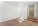 Cozy bedroom featuring neutral walls, carpeted floors, and steps to an open doorway at 3300 W 2Nd Ave, Denver, CO 80219