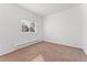 Bright bedroom featuring neutral walls, carpeted floors, and a window providing natural light at 3300 W 2Nd Ave, Denver, CO 80219