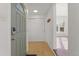 Inviting entryway with tile flooring, coat closet, and natural light flowing into the home at 3300 W 2Nd Ave, Denver, CO 80219