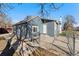 Exterior view of the home featuring a fenced front yard, walkway, and entrance at 3300 W 2Nd Ave, Denver, CO 80219