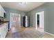 Bright kitchen with stainless steel appliances, tiled floors and an adjacent laundry area at 3300 W 2Nd Ave, Denver, CO 80219