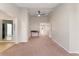 Spacious living room featuring high ceilings, neutral walls, plush carpeting, and ample room for furniture arrangement at 3300 W 2Nd Ave, Denver, CO 80219