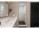 A modern bathroom with a walk-in shower and sleek fixtures at 100 Detroit St # 103, Denver, CO 80206