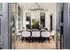 Dining room area features a wooden table with white chairs and a decorative light fixture at 100 Detroit St # 103, Denver, CO 80206