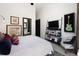 This main bedroom features a media center and artwork at 100 Detroit St # 103, Denver, CO 80206