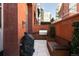 Outdoor patio area featuring a built-in gas grill, bench seating and barbecue at 100 Detroit St # 103, Denver, CO 80206