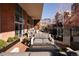 Expansive patio with a fire pit, comfortable seating, and a mix of hardscape and softscape elements at 100 Detroit St # 103, Denver, CO 80206