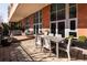 Serene outdoor patio featuring a dining set, lounge furniture, and well-maintained planters at 100 Detroit St # 103, Denver, CO 80206