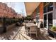 Inviting outdoor patio area with stone pavers and comfortable seating for dining and lounging at 100 Detroit St # 103, Denver, CO 80206