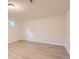 Bright bedroom with neutral walls, and light wood-look flooring, offers a calming space at 5150 W Colgate Pl, Denver, CO 80236