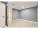 Spacious bedroom with neutral paint, and light wood-look flooring, offers a calming space at 5150 W Colgate Pl, Denver, CO 80236
