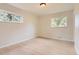 Cozy bedroom with hardwood floors and two windows providing natural light at 5150 W Colgate Pl, Denver, CO 80236