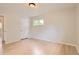 Light-filled bedroom with hardwood floors, neutral walls, and a view to the exterior at 5150 W Colgate Pl, Denver, CO 80236