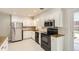 Beautiful kitchen featuring stainless steel appliances and ample cabinet space at 5150 W Colgate Pl, Denver, CO 80236