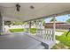 Covered patio offers a charming outdoor space with string lights, perfect for relaxation at 5150 W Colgate Pl, Denver, CO 80236