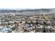 Stunning aerial view of a residential neighborhood, showcasing snow-capped mountains in the background at 6459 S Queen Way, Littleton, CO 80127