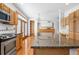 Spacious kitchen with a large island, granite countertops, and stainless steel appliances at 6459 S Queen Way, Littleton, CO 80127