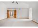 Spacious main bedroom featuring vaulted ceilings, neutral carpet, and wood trim accents at 6459 S Queen Way, Littleton, CO 80127