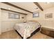 Bedroom with natural light, neutral walls, and a cozy bed; an inviting space for rest at 8094 E Kenyon Pl, Denver, CO 80237