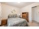 Bedroom featuring a comfortable bed, ambient lighting, and practical storage solutions at 8094 E Kenyon Pl, Denver, CO 80237