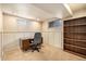 Functional office space with a desk, chair, and shelving for organized work or study at 8094 E Kenyon Pl, Denver, CO 80237