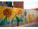 Vibrant sunflower mural on a fence adds a touch of art and nature at 4344 Wyandot St, Denver, CO 80211